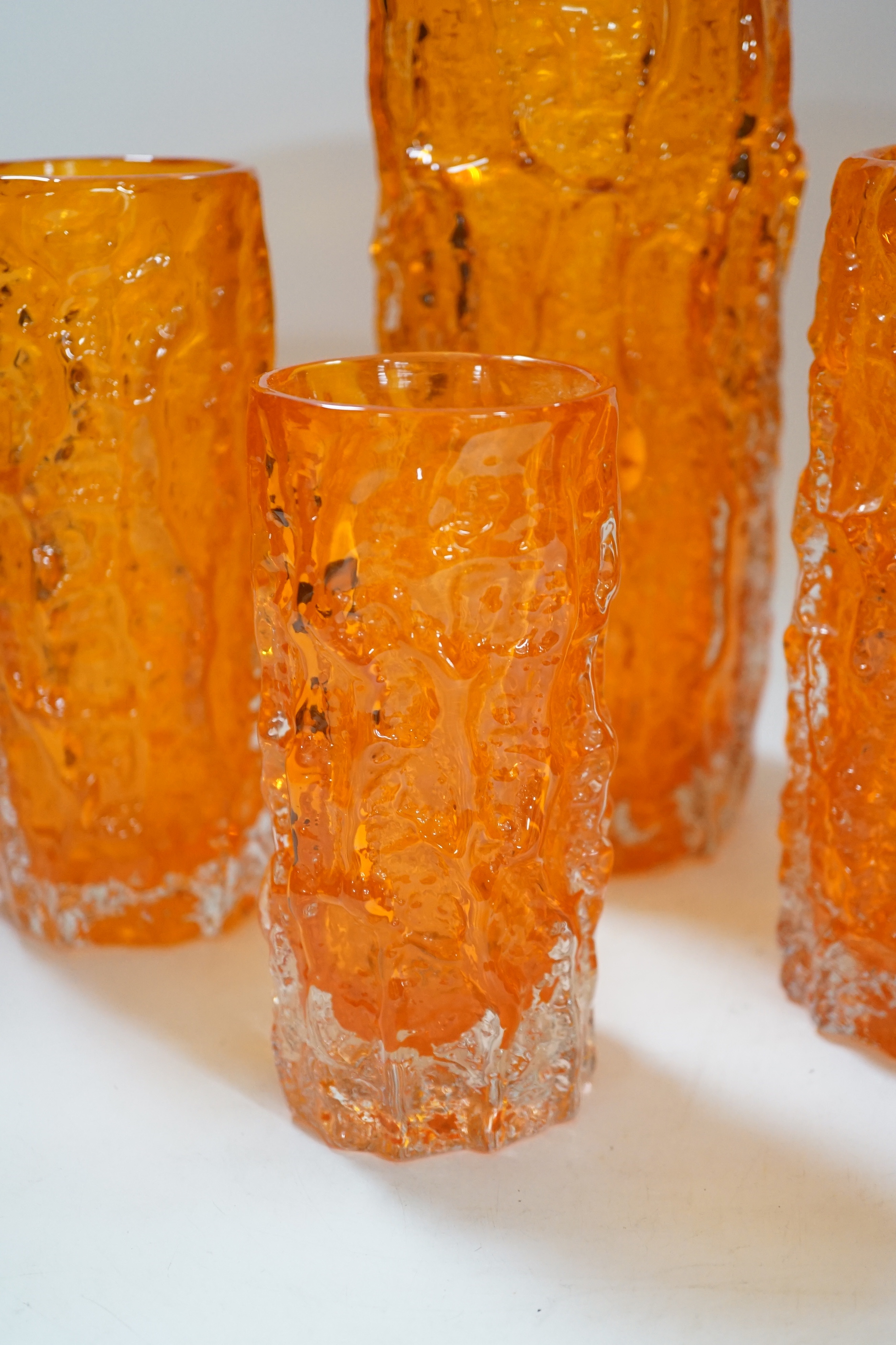 A pair and two other Whitefriars ‘bark’ vases in tangerine, tallest 24cm